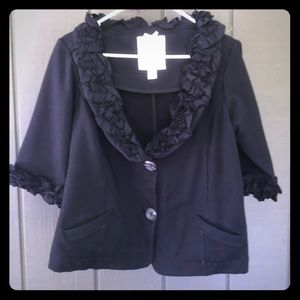 Adorable ruffled black jacket.